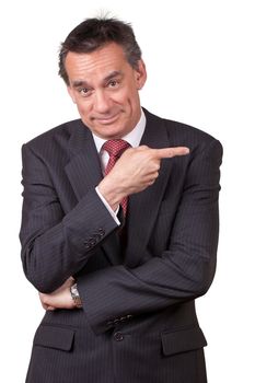 Attractive Smiling Middle Age Business Man in Suit Pointing Right Isolated