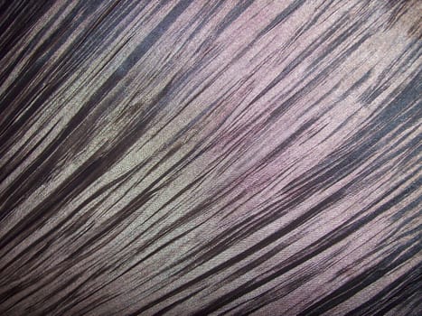 Close-up photo of creased shiny fabric