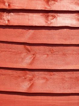Close-up photo of a stained fence panel