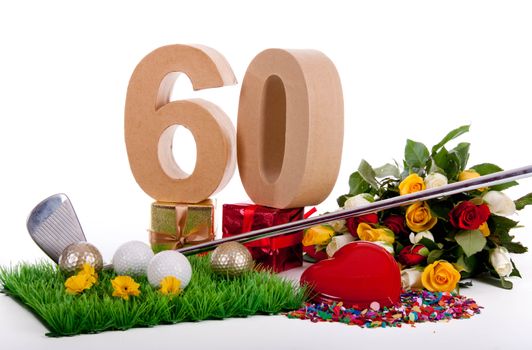 Roses, a golf club and golf balls on an artificial peace of grass to be used as a birthday card