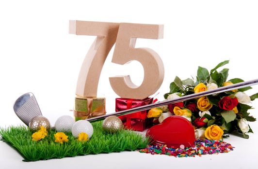 Roses, a golf club and golf balls on an artificial peace of grass to be used as a birthday card