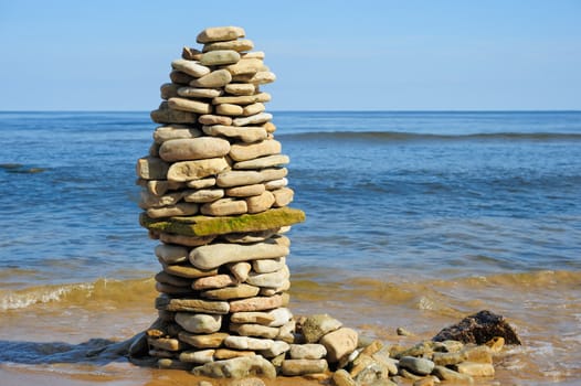 High pile of pebbles on the seacoast