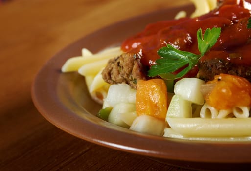  pasta with tomato beef sauce  on wooden table