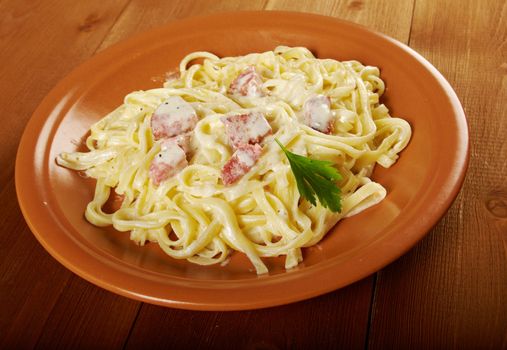 pasta Fettuccine Alfredo with sausage. close-up