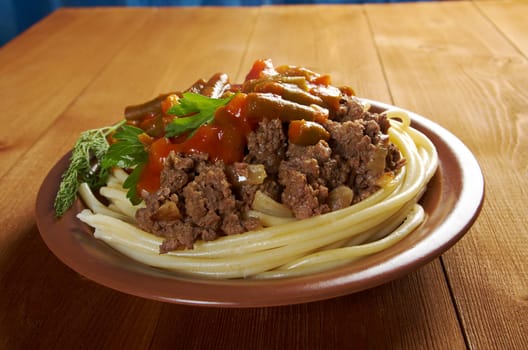  pasta with  beef ,vegetable  tomato sauce  on wooden table