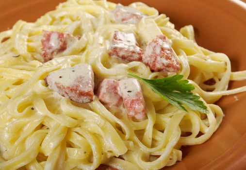 pasta Fettuccine Alfredo with sausage. close-up