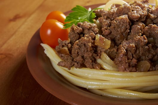  pasta with  beef on wooden table