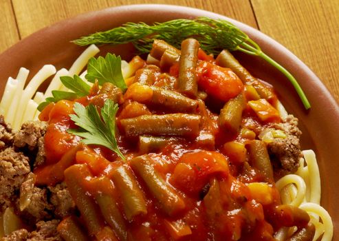  pasta with  beef ,vegetable  tomato sauce  on wooden table