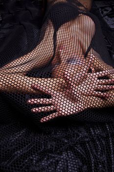 Attractive Woman Trapped In Black Fishnet