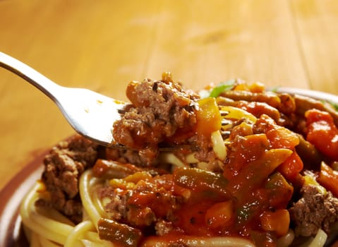  pasta with  beef ,vegetable  tomato sauce  on wooden table