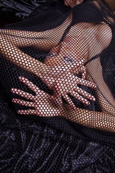 Attractive Woman Trapped In Black Fishnet