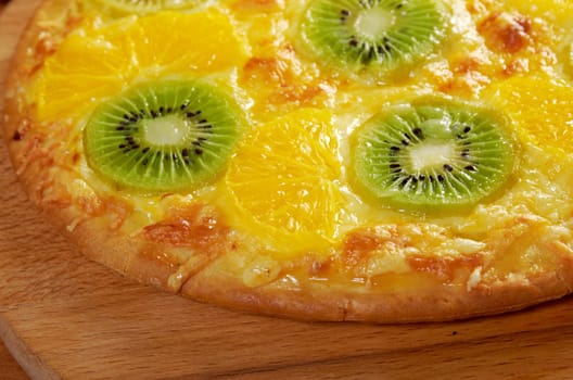 homemade sweet pizza with fruit.with orang kiwi,sauce
