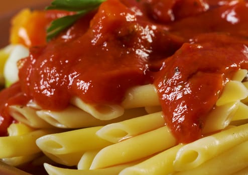  pasta with tomato beef sauce  on wooden table