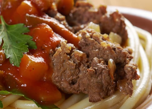  pasta with  beef ,vegetable  tomato sauce  on wooden table
