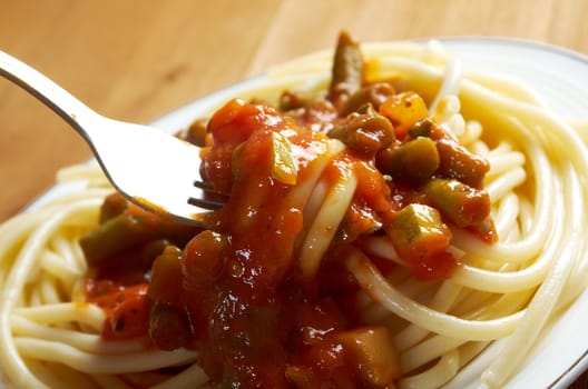  pasta with tomato  sauce  on wooden table