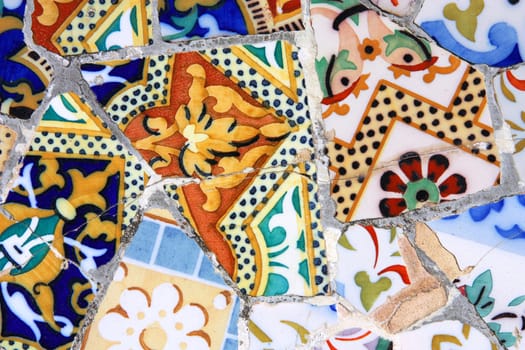 Colorful mosaic background in Park Guell, Barcelona. Art abstract.