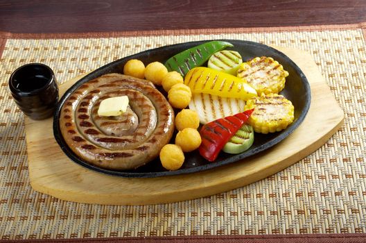 Japanese cuisine .Sausage making roasted with vegetable