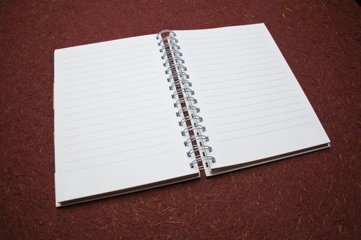 Clear page on diary ready for writing, pencil, background
