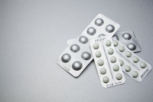 Silver Pills On Metal Table Background, copy space