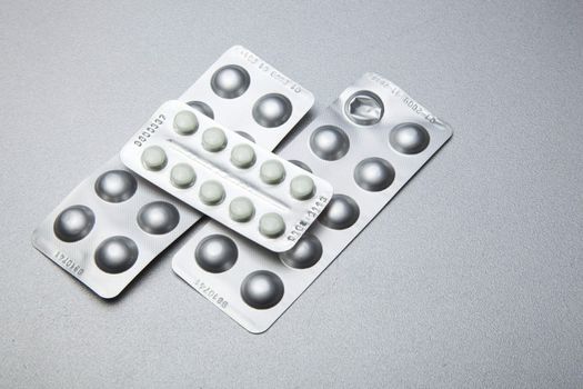 Silver Pills On Metal Table Background, copy space
