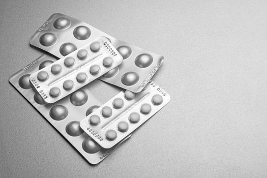 Silver Pills On Metal Table Background, copy space