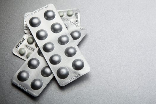Silver Pills On Metal Table Background, copy space