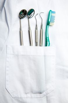 White Dentist Pocket With Toothbrush And Angled Mirror