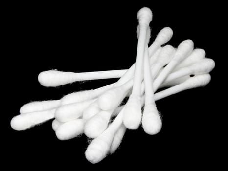 Cotton buds on a black background.
