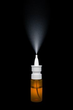 An image of a nasal spray on black