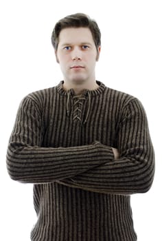 Man in a woolen sweater with arms crossed. Isolated on white.