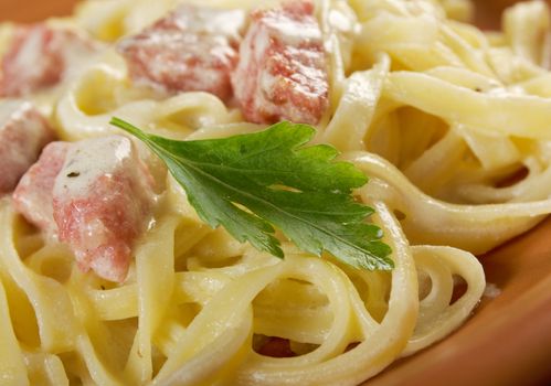 pasta Fettuccine Alfredo with sausage. close-up