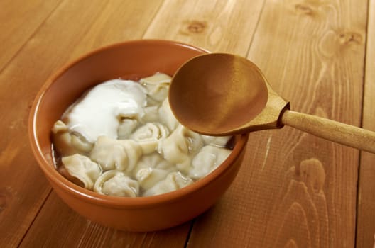 Traditional Russian food "pelmeni".Meat dumplings  with sour cream