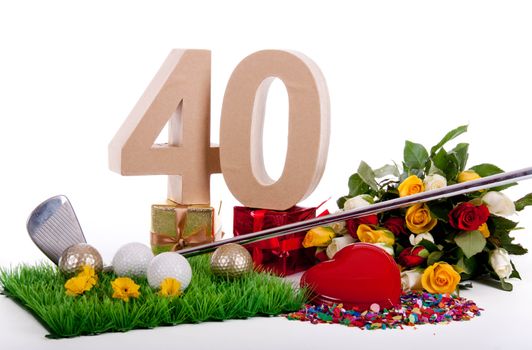 Roses, a golf club and golf balls on an artificial peace of grass to be used as a birthday card
