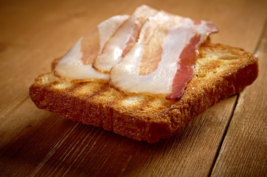 pile  toasted bread slices for bacon.Close up of toasted white bread in slices