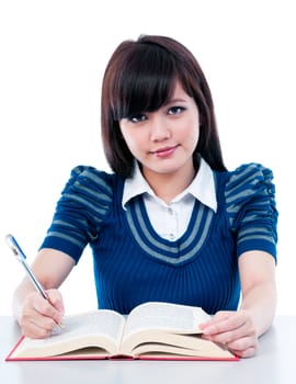 Portrait of an attractive Asian female student studying.