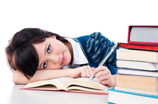 Portrait of a cute female student resting on her arm over white background.