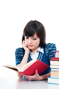 Portrait of a cute female student studying over white background.