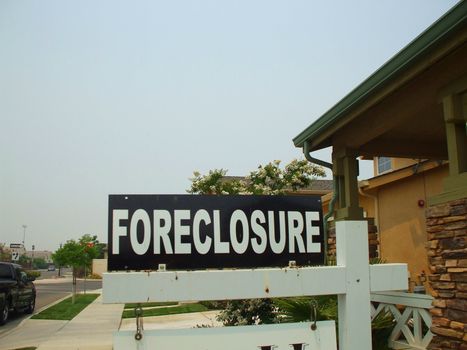 Close up of a foreclosure sign.