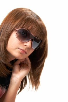 The girl in a black vest sits on a floor - a white background 