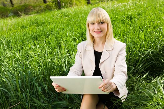 happy young businesswoman with laptop