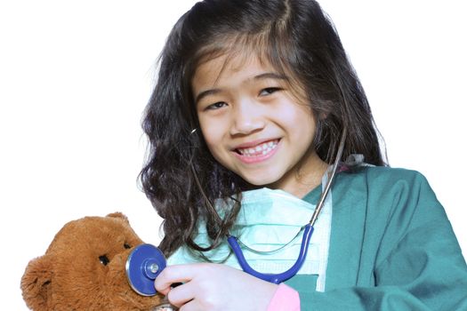 Six year old girl playing doctor