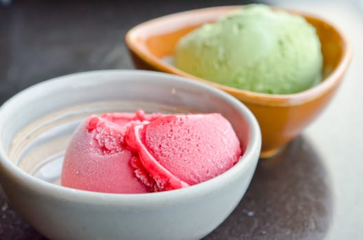 close up strawberry ice cream  and green tea ice cream in  bowl