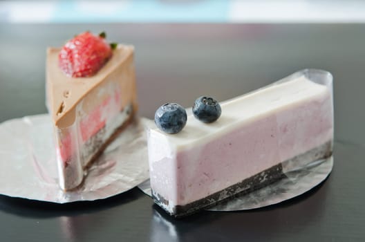 blueberries cheesecake and strawberry cheesecake , delicious and sweet