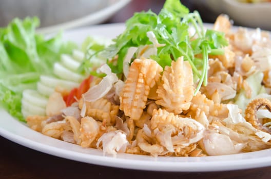 fried squids and  fried garlic served with vegetable