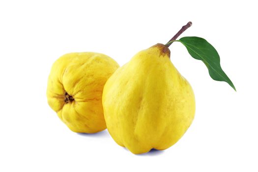 sweet quinces with leaves and slice on white with a clipping path
