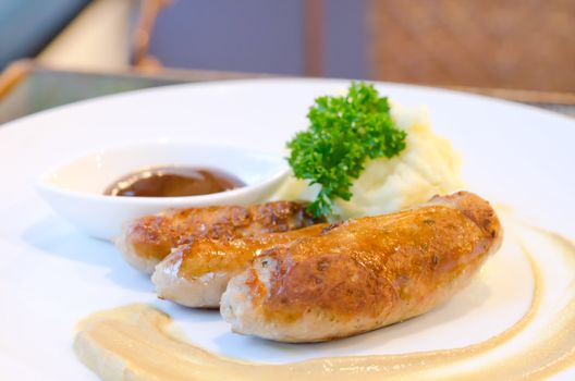 grilled sausage and  mashed potato served with sweet sauce