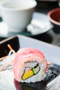  japanese food roll made of fish on dish