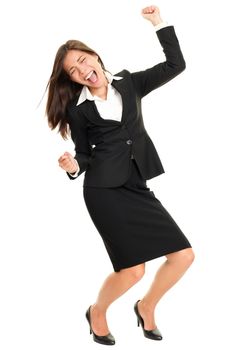 Celebrating business woman dancing happy and joyful cheering in suit isolated on white background in full body. Ecstatic and excited beautiful multiracial Caucasian / Chinese Asian young business woman.