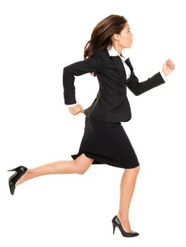 Business woman running in suit in full body isolated on white background. Business concept image with young mixed race Caucasian / Chinese Asian businesswoman.