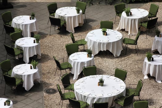 Rome, Italy - view of an outdoor restaurant. Tables and chairs.